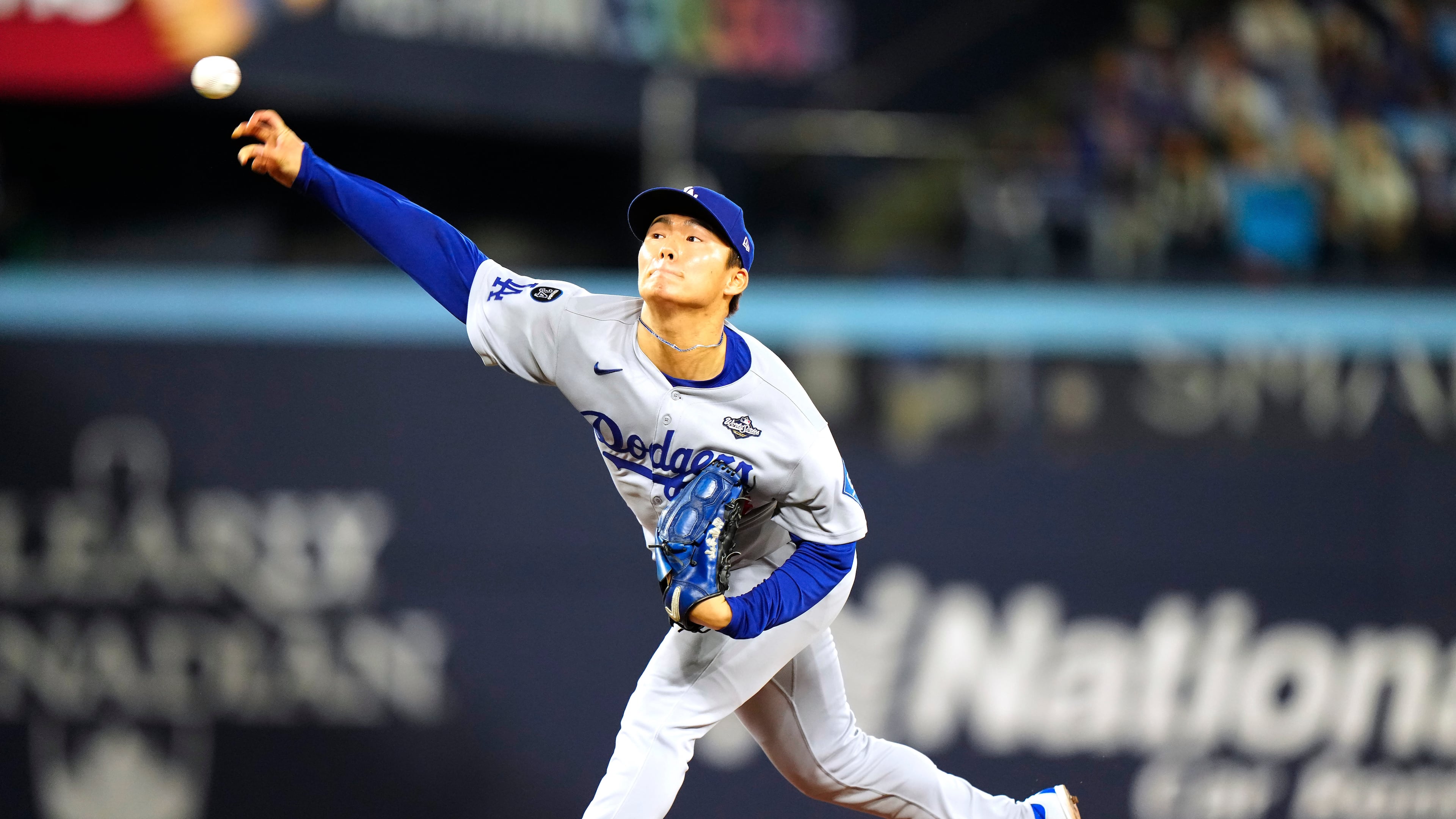 Los Angeles Dodgers pitcher Yoshinobu Yamamoto (18) delivers against the Toronto Blue Jays during the first inning in Game 2 of baseball's World Series, Saturday, Oct. 25, 2025, in Toronto. (Frank Gunn/The Canadian Press via AP)
