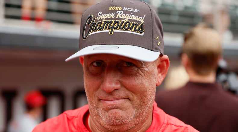 Georgia Bulldogs head coach Wes Johnson reacts while wearing his championship hat as he celebrates with his team after winning the NCAA Super Regional series, defeating the Mississippi State Bulldogs 11-9 at Foley Field on Sunday, June 7, 2026, in Athens.
Miguel Martinez/AJC)