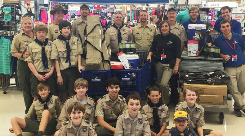Boy Scout Troop 1109 pose with some of their new camping equipment at Academy Sports + Outdoors in Cumming.