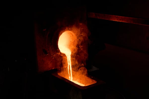 Molten gold is poured into a mold at A&M Precious Metals in the St. Vincent Jewelry Center in the Jewelry District of Los Angeles, Friday, May 2, 2025. (AP Photo/Jae C. Hong)