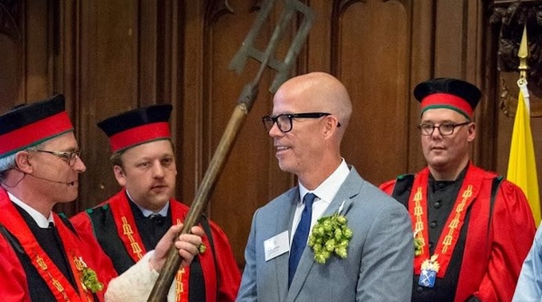 Frank Boon (left) of Boon Brewery honors Dave Blanchard of Brick Store Pub as a knight of the Brewers Paddle. CONTRIBUTED BY: Belgian Brewers.