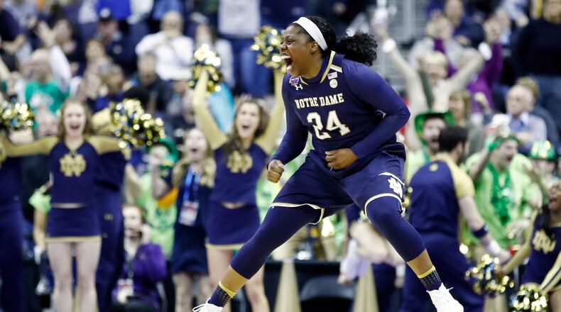 Arike Ogunbowale #24 of the Notre Dame Fighting Irish celebrates her game winning basket with one second left in overtime against the Connecticut Huskies in the semifinals of the 2018 NCAA Women's Final Four at Nationwide Arena on March 30, 2018 in Columbus, Ohio. The Notre Dame Fighting Irish defeated the Connecticut Huskies 91-89.  (Photo by Andy Lyons/Getty Images)