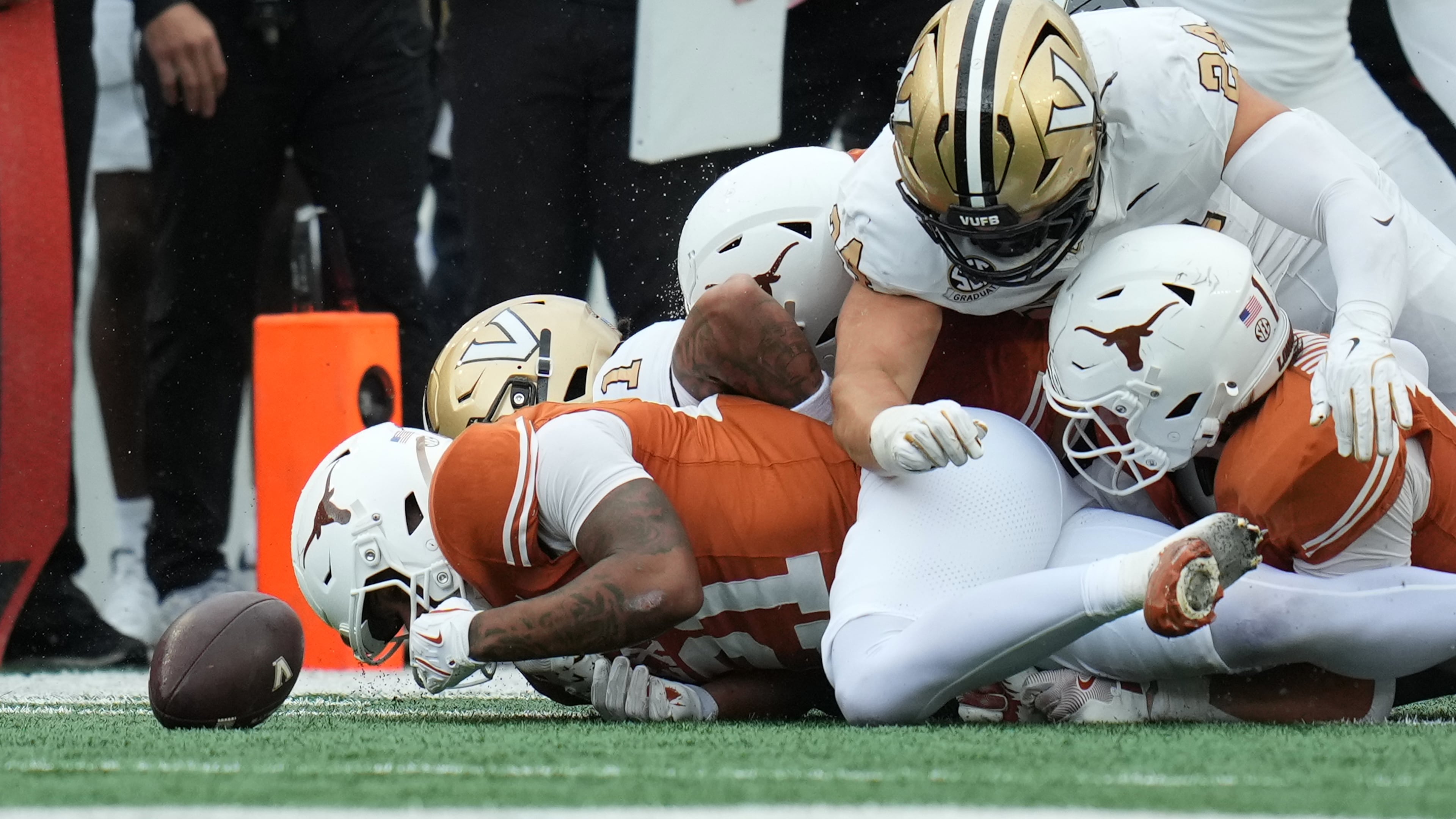 Texas wide receiver Ryan Niblett (21) dives ahead of Vanderbilt players for an onside kick during the second half of an NCAA college football game in Austin, Texas, Saturday, Nov. 1, 2025. (AP Photo/Eric Gay)
