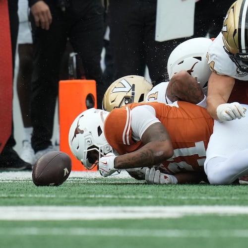 Texas wide receiver Ryan Niblett (21) dives ahead of Vanderbilt players for an onside kick during the second half of an NCAA college football game in Austin, Texas, Saturday, Nov. 1, 2025. (AP Photo/Eric Gay)