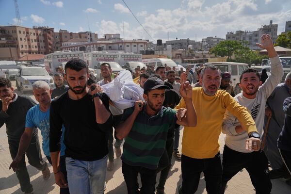 Palestinians carry the body of Hosam Wafi who, according to family members, was killed in an Israeli strike, during his funeral in Khan Younis, southern Gaza Strip, Monday, June 2, 2025. (AP Photo/Abdel Kareem Hana)