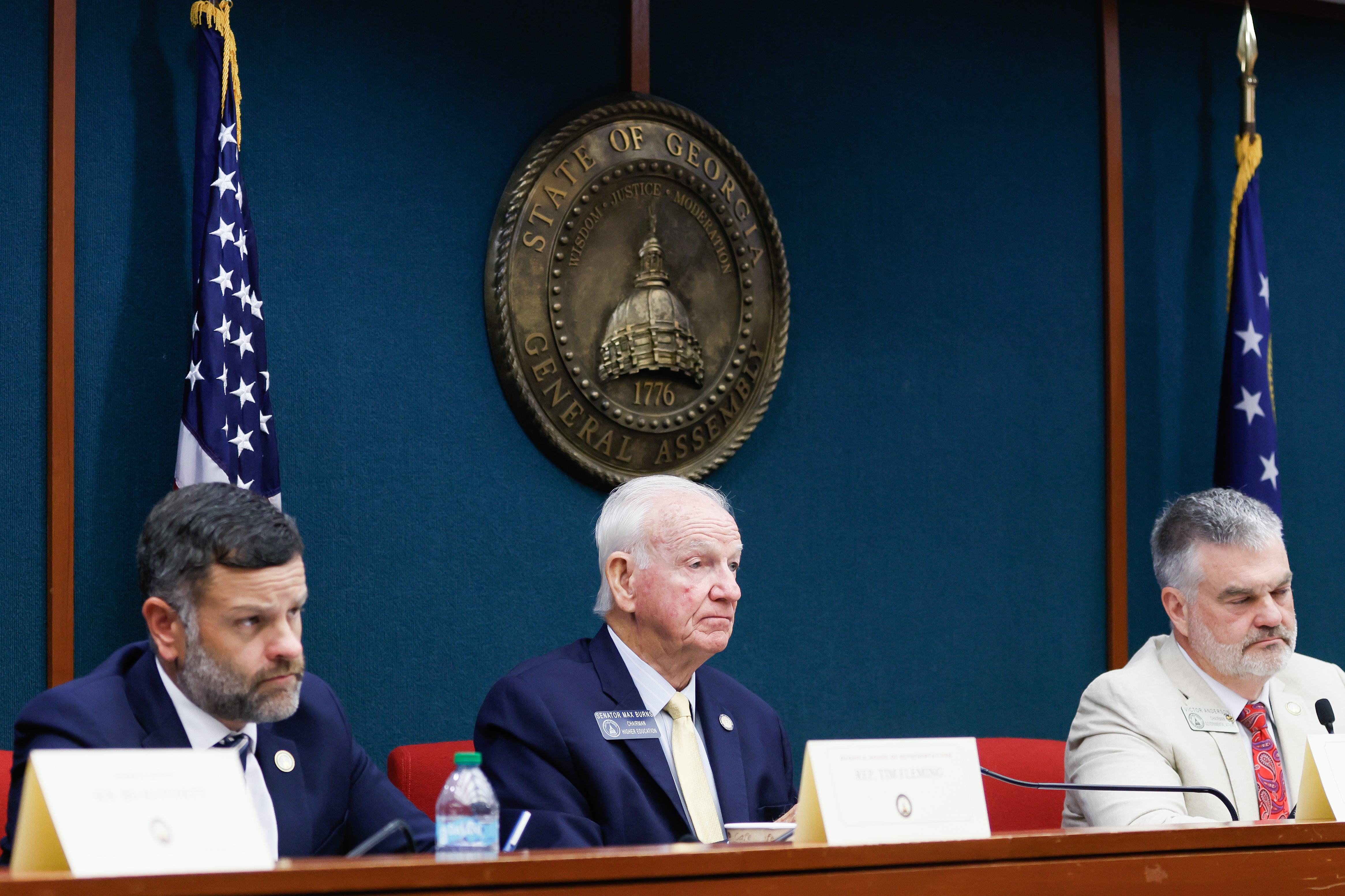 State Rep. Tim Fleming, State Sen. Max Burns and State Rep. Victor Anderson listen during a voting system committee meeting at the Paul D. Coverdell Legislative Office Building in Atlanta on Friday, Aug. 7, 2026. (Abbey Cutrer/AJC)