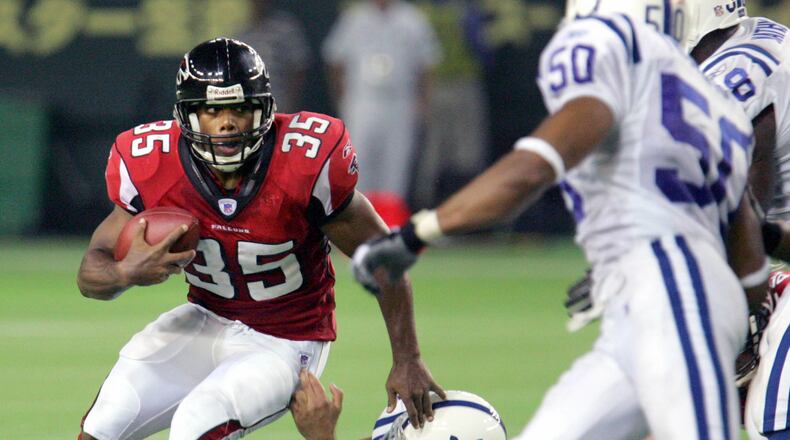 Atlanta Falcons running back Jason Wright, left, is tackled by Indianapolis Colts defensive end Josh Mallard in the second quarter of their NFL's exhibition season game American Bowl at Tokyo Dome Saturday, Aug. 6, 2005. (AP Photo/Koji Sasahara)