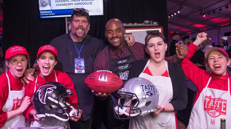Atlanta restaurateur Kevin Rathbun (third from left) and former Atlanta Falcons player Chris Draft participate in a Taste of the NFL event held in Houston in conjunction with the 2017 Super Bowl. Rathbun and Draft have been involved with the Taste of the NFL nonprofit for years, serving as the Atlanta Falcons chef representative and player representative, respectively. CONTRIBUTED BY TOM DONOHUE