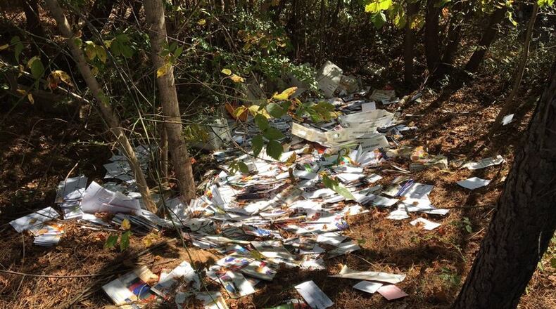 The man is accused of dumping mail in DeKalb County.