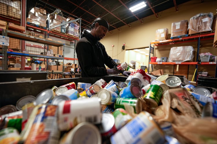 Volunteer Matthew Underwool works at MUST Ministries food distribution center, Monday, Nov. 3, 2025, in Marietta. (Mike Stewart/AP)