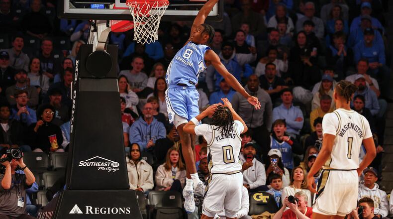 North Carolina forward Caleb Wilson (8) dunks over Georgia Tech guard Akai Fleming (0) during the first half of an NCAA college basketball game, Saturday, Jan. 31, 2026, in Atlanta. (AP Photo/Colin Hubbard)