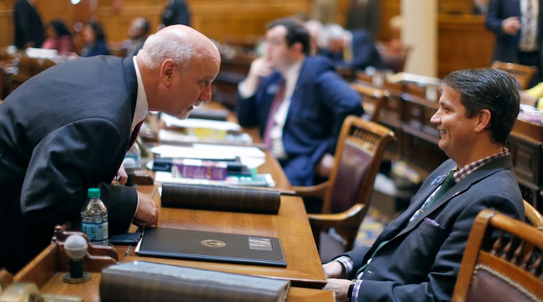 State Sen. Brandon Beach (left), confers with Sen. Michael Williams. Bob Andres, bandres@ajc.com