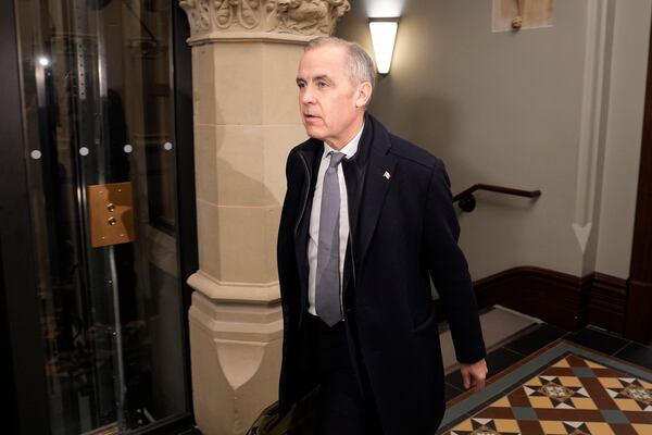 Prime Minister Mark Carney arrives on Parliament Hill to chair a meeting of the Cabinet Committee on Canada-U.S. Relations and National Security, Thursday, March 27, 2025 in Ottawa. (Adrian Wyld /The Canadian Press via AP)