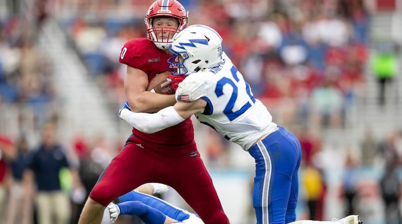 Florida Atlantic Owls tight end Harrison Bryant (40) is hit by Air Force Falcons defensive back Garrett Kauppila (22) near the goal line Sept. 8, 2018, at FAU Stadium in Boca Raton, Fla.