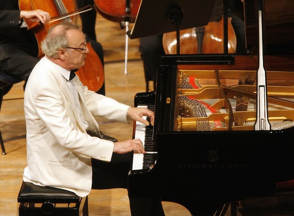 FILE- Austrian pianist Alfred Brendel performs at the piano with the Royal Concertgebouw Orchestra at the Lucerne Festival in Lucerne, Switzerland on Sept. 5, 2006. (AP Photo/Keystone, Urs Flueeler, File)