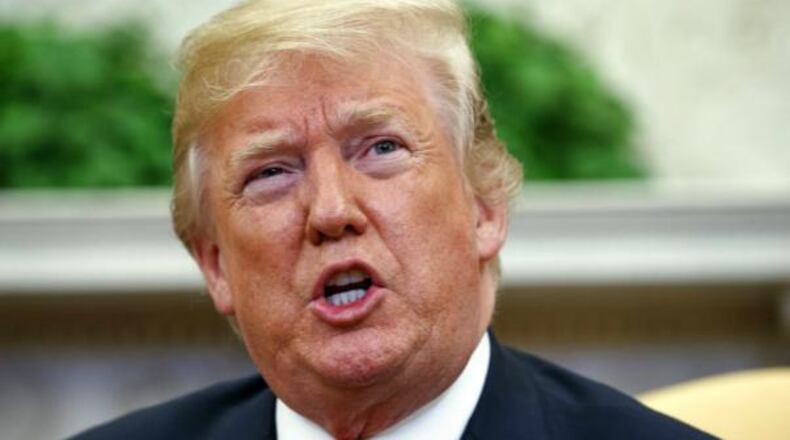 In this May 17, 2018 photo, President Donald Trump speaks in the Oval Office of the White House in Washington.