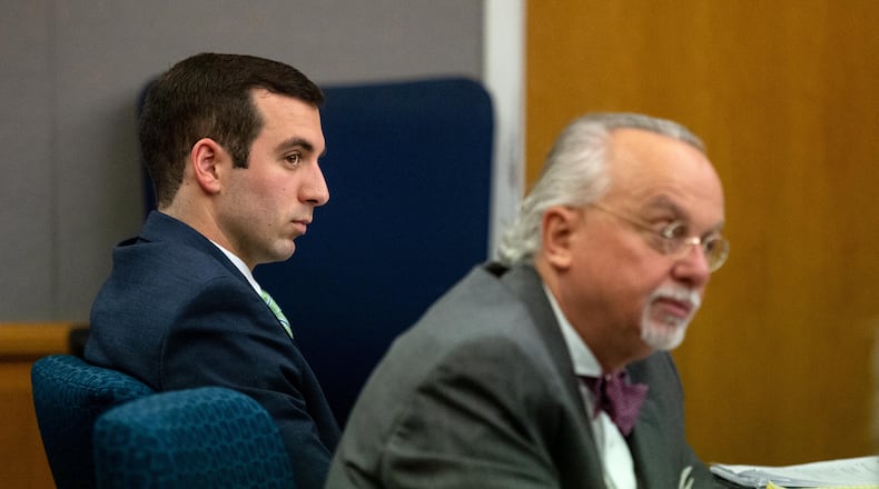 County police officer Robert McDonald sits next to his attorney Walt Britt during his trial at the Gwinnett Justice and Administration building in Lawrenceville, February 4, 2020.  STEVE SCHAEFER / SPECIAL TO THE AJC