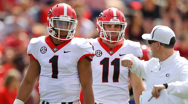 Georgia quarterbacks Jake Fromm and Justin Fields prepare to play in the annual G-Day spring intrasquad football game on Saturday, April 21, 2018, in Athens. Curtis Compton/ccompton@ajc.com