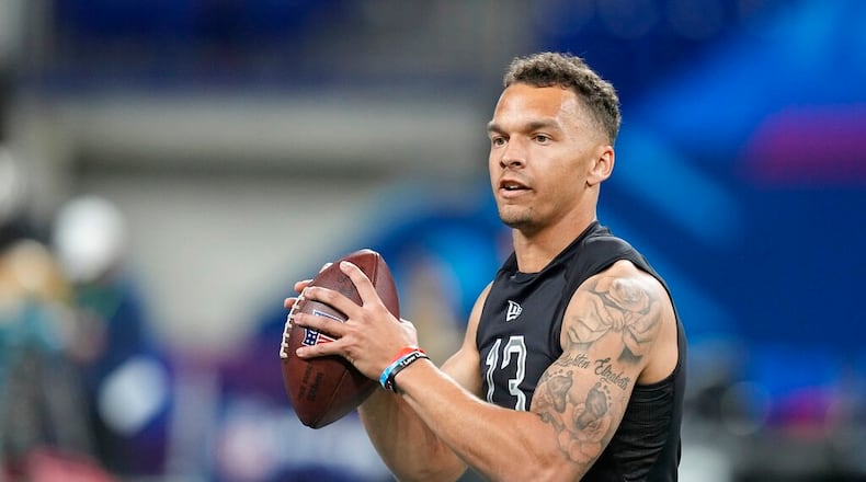 Cincinnati quarterback Desmond Ridder runs a drill during the NFL football scouting combine, Thursday, March 3, 2022, in Indianapolis. (AP Photo/Darron Cummings)