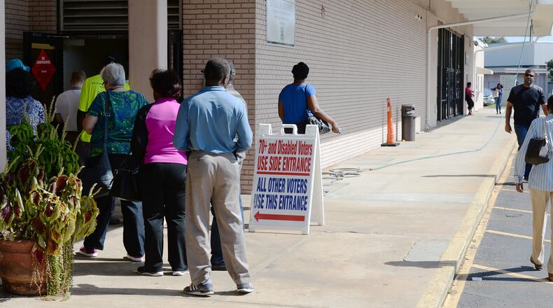 DeKalb County voters line up for early voting at the Voter Registration & Elections office Oct. 17. KENT D. JOHNSON / AJC
