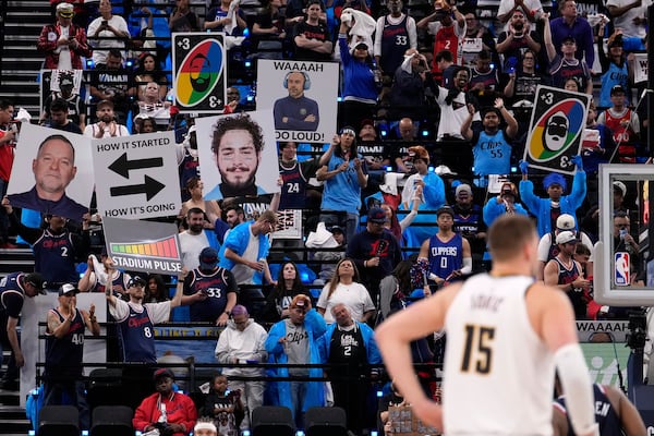 Fans taunt the Denver Nuggets from "The Wall" during the second half in Game 3 of an NBA basketball first-round playoff series against the Los Angeles Clippers Thursday, April 24, 2025, in Inglewood, Calif. (AP Photo/Mark J. Terrill)