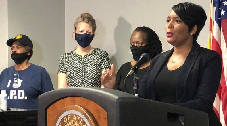 Atlanta Mayor Keisha Lance Bottoms, right, speaks during a press conference at Atlanta police headquarters about the Saturday night shooting death of 8-year-old Secoriea Turner. J. SCOTT TRUBEY/SCOTTl.TRUBEY@AJC.COM