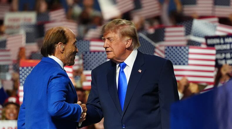 President Donald Trump greets Lee Greenwood at the Republican convention, Wednesday, Sept. 9, 2026, in Dallas. (AP Photo/Julia Demaree Nikhinson)