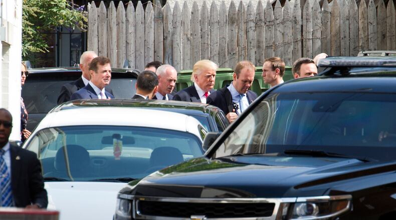 Republican presidential candidate Donald Trump departs a meeting with Republican House members at the Capitol Hill Club in Washington, Thursday, July 7, 2016. (AP Photo/Cliff Owen)