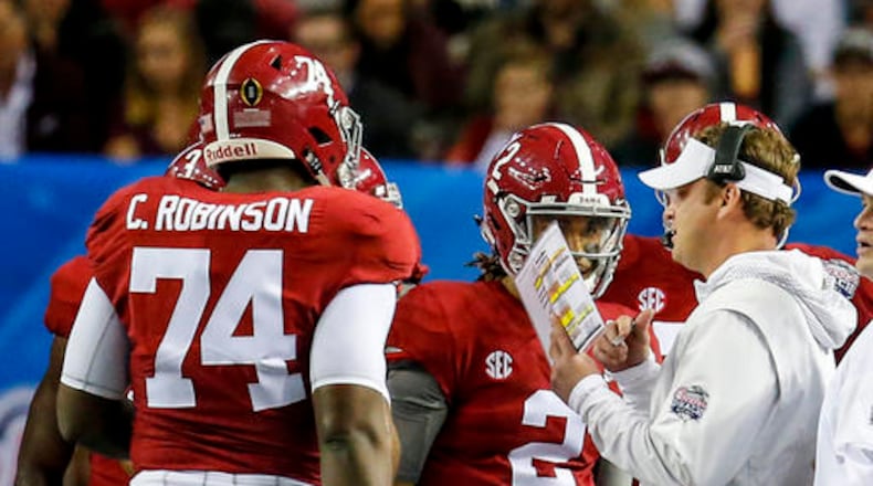 Alabama offensive coordinator Lane Kiffin talks with players during the first half of the Peach Bowl NCAA college football game against Washington, Saturday, Dec. 31, 2016, in Atlanta. (AP Photo/Butch Dill)