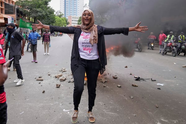 Kenyan activist Hanifa gestures during a demonstration over the death of blogger Albert Ojwang in police custody, in downtown Nairobi, Kenya, Tuesday, June 17, 2025. (AP Photo/Brian Inganga)