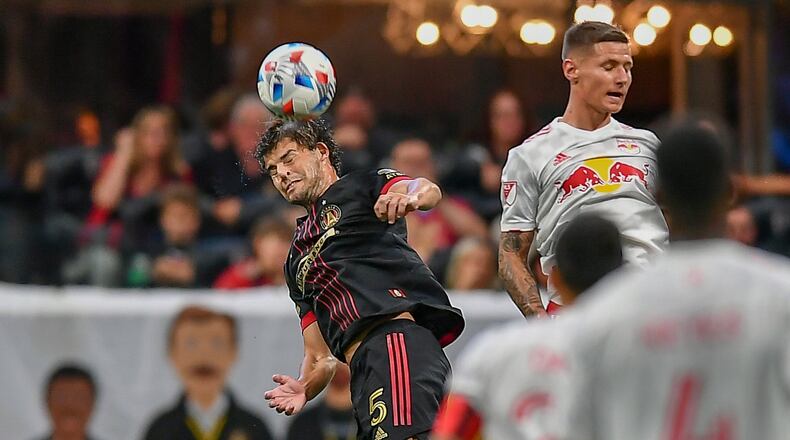 Atlanta United midfielder Santiago Sosa (5) heads the ball against the New York Red Bulls Sunday, June 27, 2021, at Mercedes-Benz Stadium in Atlanta. (Rich von Biberstein/Icon Sportswire)