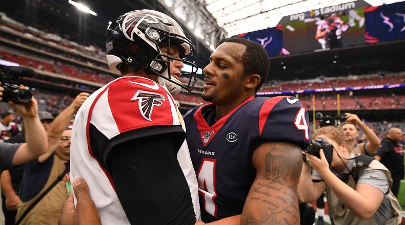 Falcons quarterback Matt Ryan and Houston's Deshaun Watson meet after the game Oct. 6, 2019, at NRG Stadium in Houston. The Falcons reportedly have shown some interest in Watson.