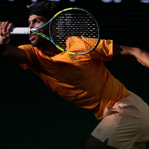 Carlos Alcaraz, of Spain, returns a shot against Daniil Medvedev, of Russia, during a semifinal match at the BNP Paribas Open tennis tournament, Saturday, March 14, 2026, in Indian Wells, Calif. (AP Photo/Mark J. Terrill)