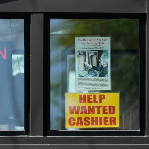 A hiring sign is displayed at a restaurant in Morton Grove, Ill., Thursday, May 14, 2026. (AP Photo/Nam Y. Huh)