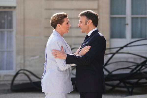 French President Emmanuel Macron, right, greets Denmark's Prime Minister Mette Frederiksen during arrivals for a summit on Ukraine at the Elysee Palace in Paris, Thursday, March 27, 2025 . (AP Photo/Thibault Camus)