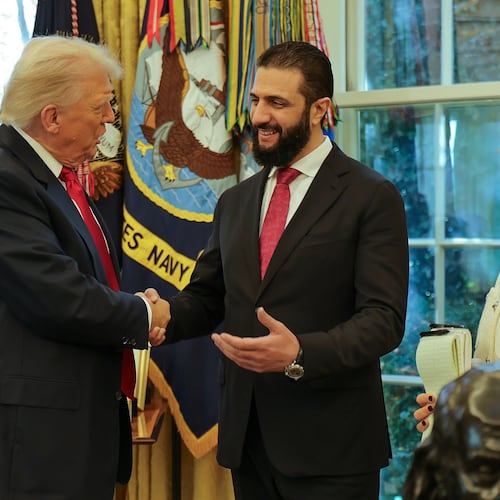 In this photo released by Syrian Presidency press office, President Donald Trump, left, shakes hands with Syria's President Ahmad al-Sharaa, at the White House in Washington, Monday, Nov. 10, 2025. (Syrian Presidency press office via AP)