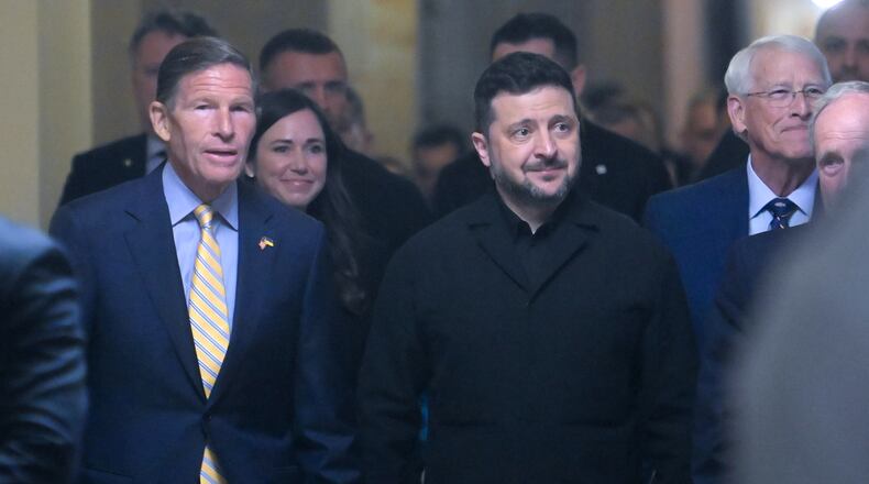 Ukraine President Volodymyr Zelenskyy, is joined by from left: Sen. Richard Blumenthal, D-Conn., Sen. Katie Boyd Britt, R-Ala., Sen. Roger Wicker, R-Miss., and Sen. James Risch, R-Idaho, as he arrives at the U.S. Capitol for a meeting of bipartisan leaders of the Lindsey O. Graham Sanctioning Russia and Iran Act of 2026, Tuesday, July 28, 2026, in Washington. (AP Photo/Rod Lamkey, Jr.)