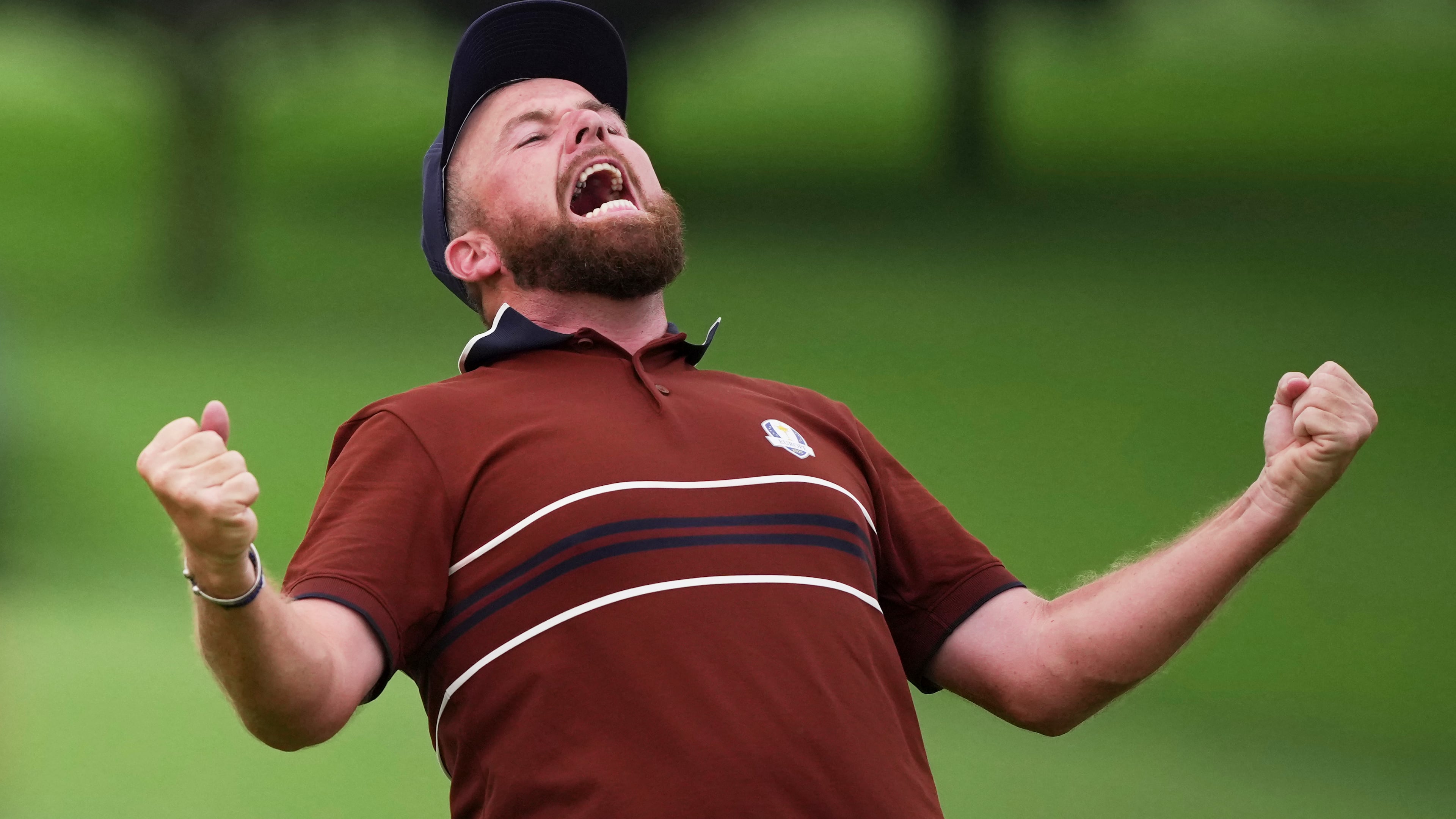 Europe's Shane Lowry react after their match win on the 18th hole at Bethpage Black golf course during the Ryder Cup golf tournament, Saturday, Sept. 27, 2025, in Farmingdale, N.Y. (AP Photo/Matt Slocum)