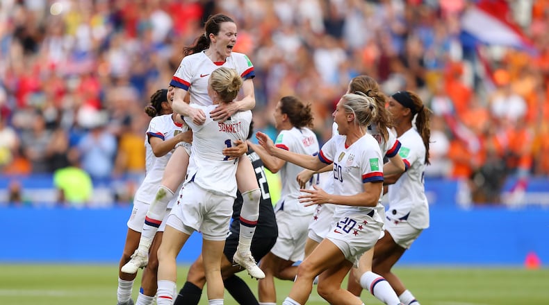 LYON, FRANCE - JULY 07:  Rose Lavelle of the USA celebrates with Emily Sonnett of the USA and teammates at full-time after winning the 2019 FIFA Women's World Cup France Final match between The United States of America and The Netherlands at Stade de Lyon on July 07, 2019 in Lyon, France. (Photo by Richard Heathcote/Getty Images)
