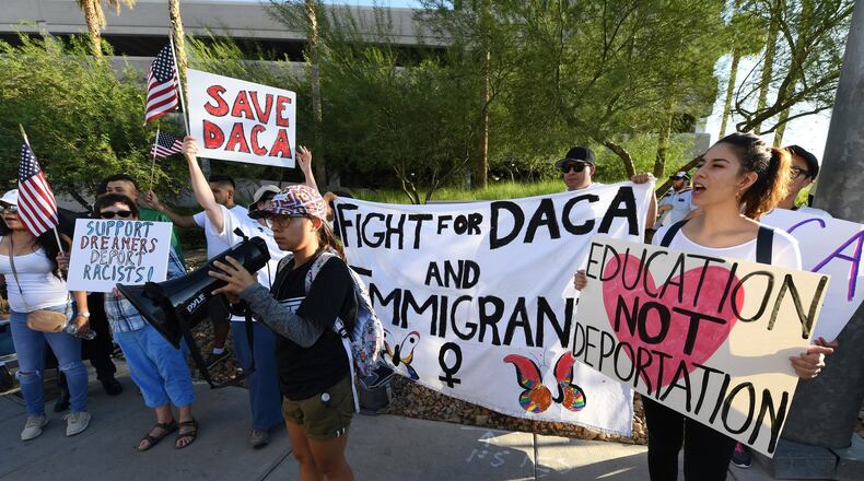 Demonstrators gather across the street from the Trump International Hotel & Tower Las Vegas for a “We Rise for the Dream” rally to oppose U.S. President Donald Trump’s order to end DACA on Sept. 10, in Las Vegas, Nevada.