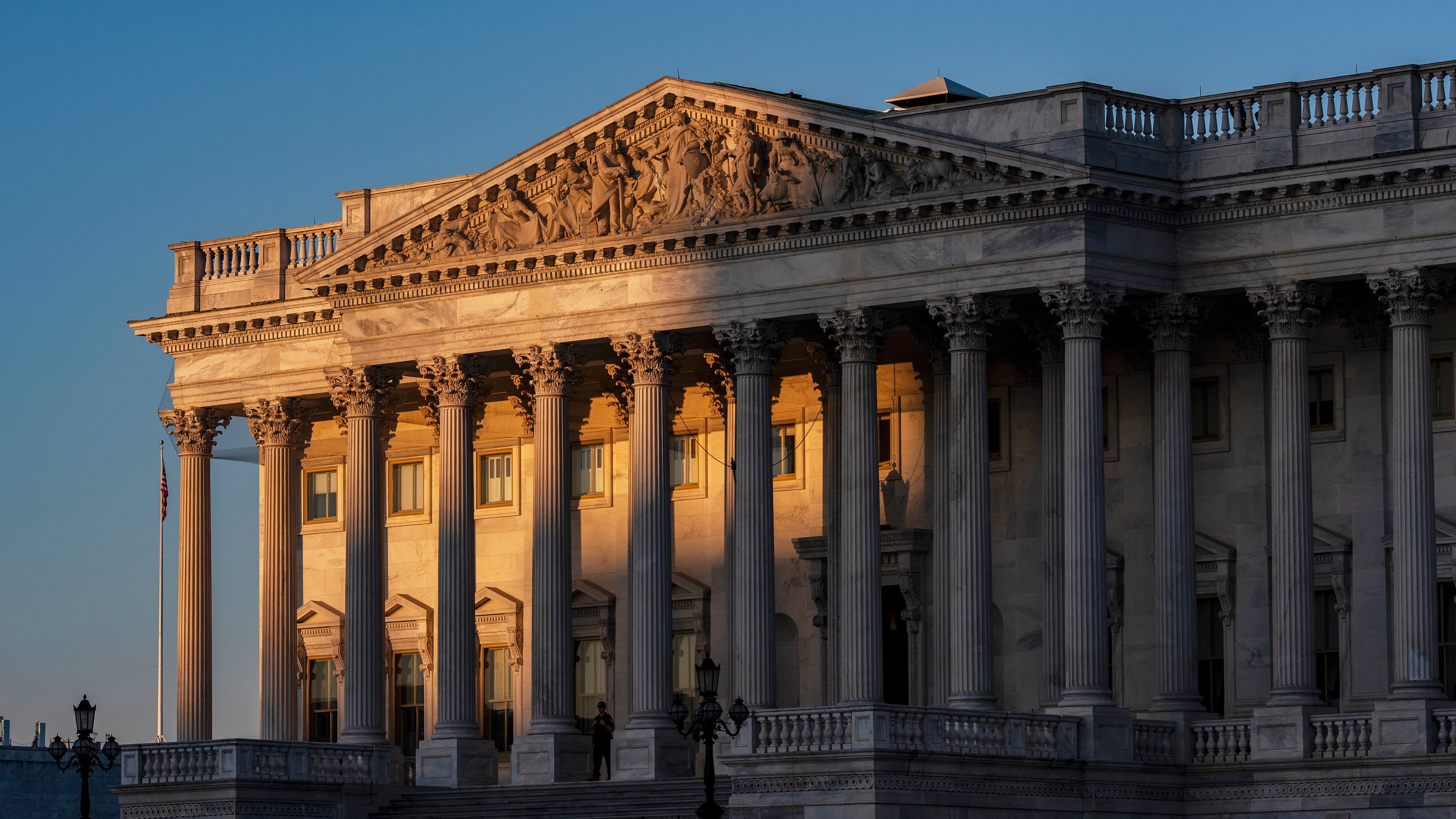 FILE - The House of Representatives at the Capitol is illuminated at dawn in Washington, Oct. 6, 2025. (AP Photo/J. Scott Applewhite, File)