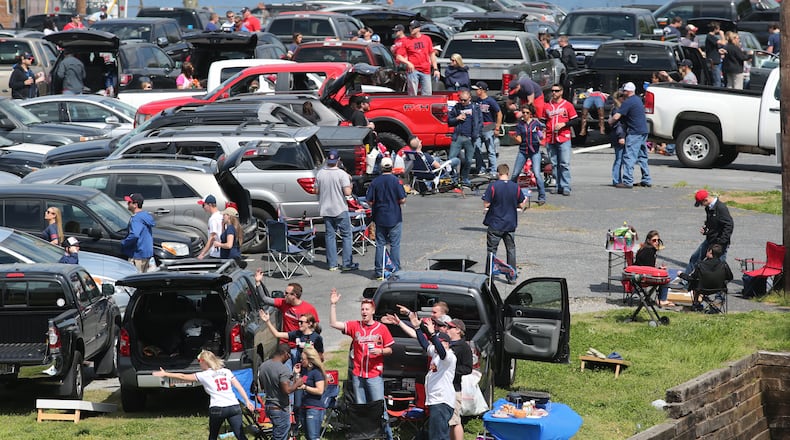 Fans tailgate at the Braves home opener at Turner Field Tuesday afternoon, April 8, 2014.