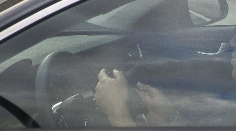 Georgia lawmakers are debating the fines for distracted driving.