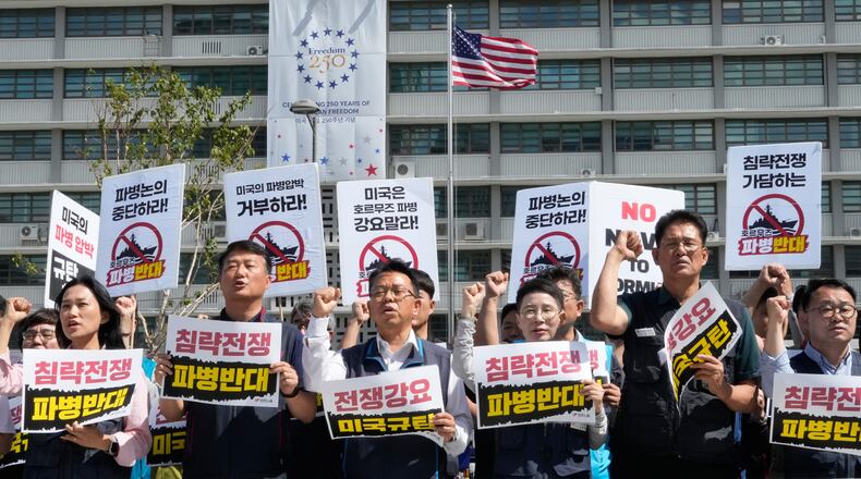 Protesters stage a rally against the possible deployment of South Korean troops to the Strait of Hormuz and a U.S. demand for the deployment, near the U.S. Embassy in Seoul, South Korea, Thursday, Sept. 17, 2026. The banners read ''Oppose troop deployment.'' (AP Photo/Ahn Young-joon)