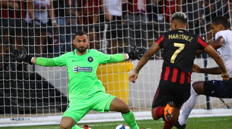 July 10, 2019 Kennesaw: St. Louis goalkeeper Tomas Gomez blocks a shot by Atlanta United midfielder Josef Martinez in a U.S. Open Cup quarterfinals soccer match on Wednesday, July 10, 2019, in Kennesaw. Curtis Compton/ccompton@ajc.com