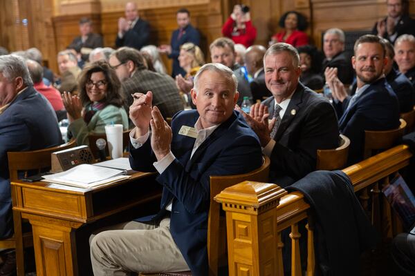 Legislators, including state Rep. Johnny Chastain, clapped for first lady Marty Kemp during budget hearings at the Capitol in Atlanta on Tuesday. (Arvin Temkar/AJC)