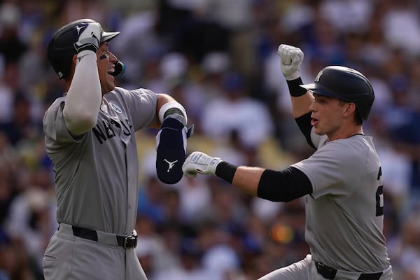 New York Yankees' Ben Rice, right, is congratulated by Aaron Judge after hitting a two-run home run during the third inning of a baseball game against the Los Angeles Dodgers, Sunday, June 1, 2025, in Los Angeles. (AP Photo/Mark J. Terrill)