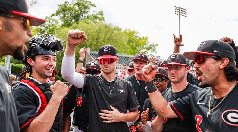 Georgia players surround backup catcher Will David to celebrate Sunday's 9-4, series-clinching win over No. 18 Tennessee at Foley Field. David, normally an infielder, has filled in with Fernando Gonzalez and Corey Collins both injured. (Kari Hodges/UGA Athletics)