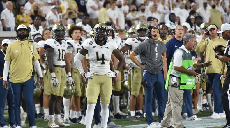 Georgia Tech's sideline watches Northern Illinois score the game-winning touchdown Saturday. (Hyosub Shin / Hyosub.Shin@ajc.com)