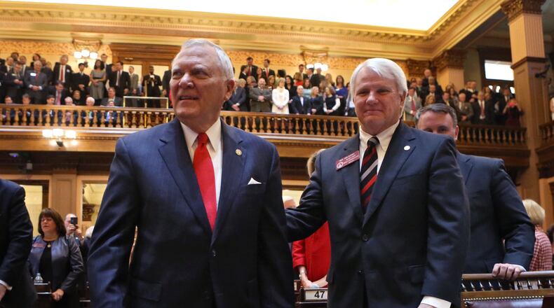 Gov. Nathan Deal (left) announced a solid increase in collections for October . BOB ANDRES / BANDRES@AJC.COM